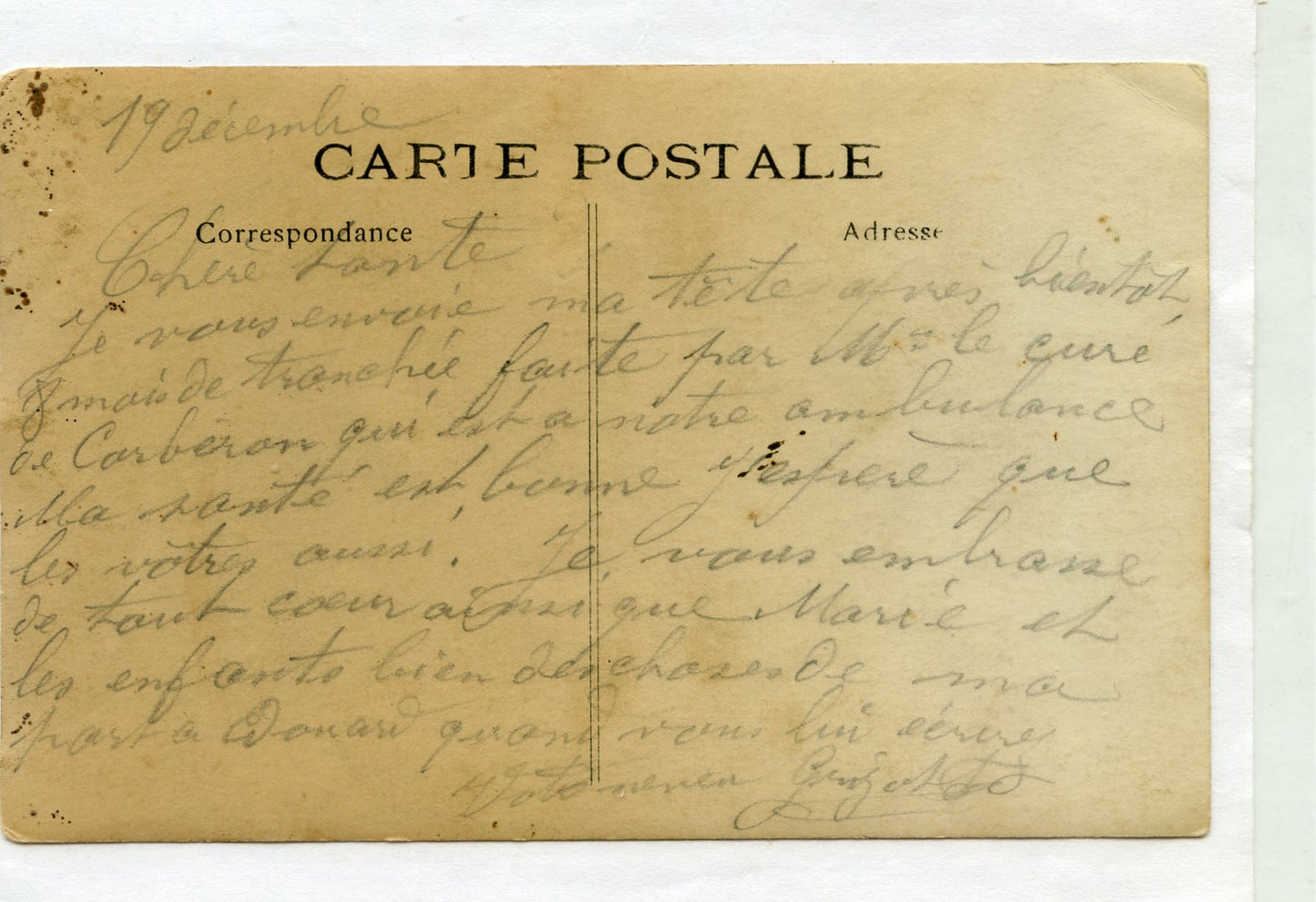 carte photo d'un poilu redescendant des lignes équipé capote Poiret vers 1915 texte au dos